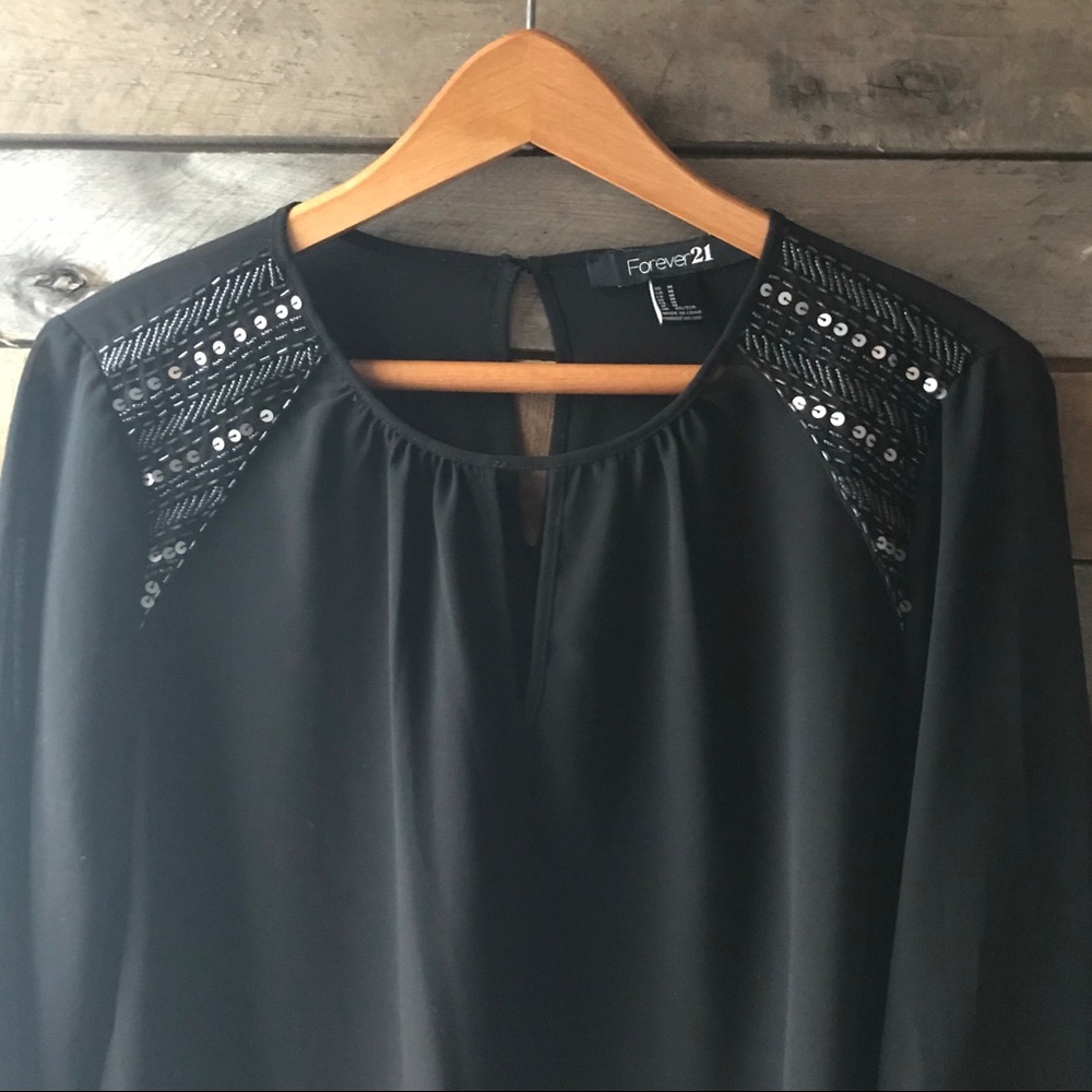 Sheer blouse with beaded shoulders